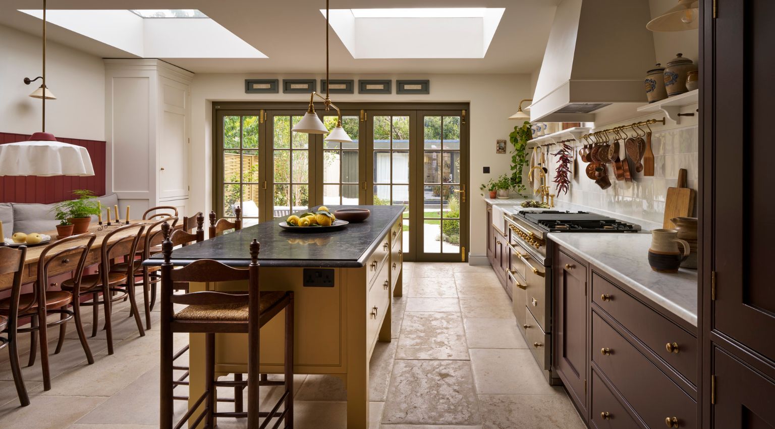 View to contemporary kitchen island and natural dining table
