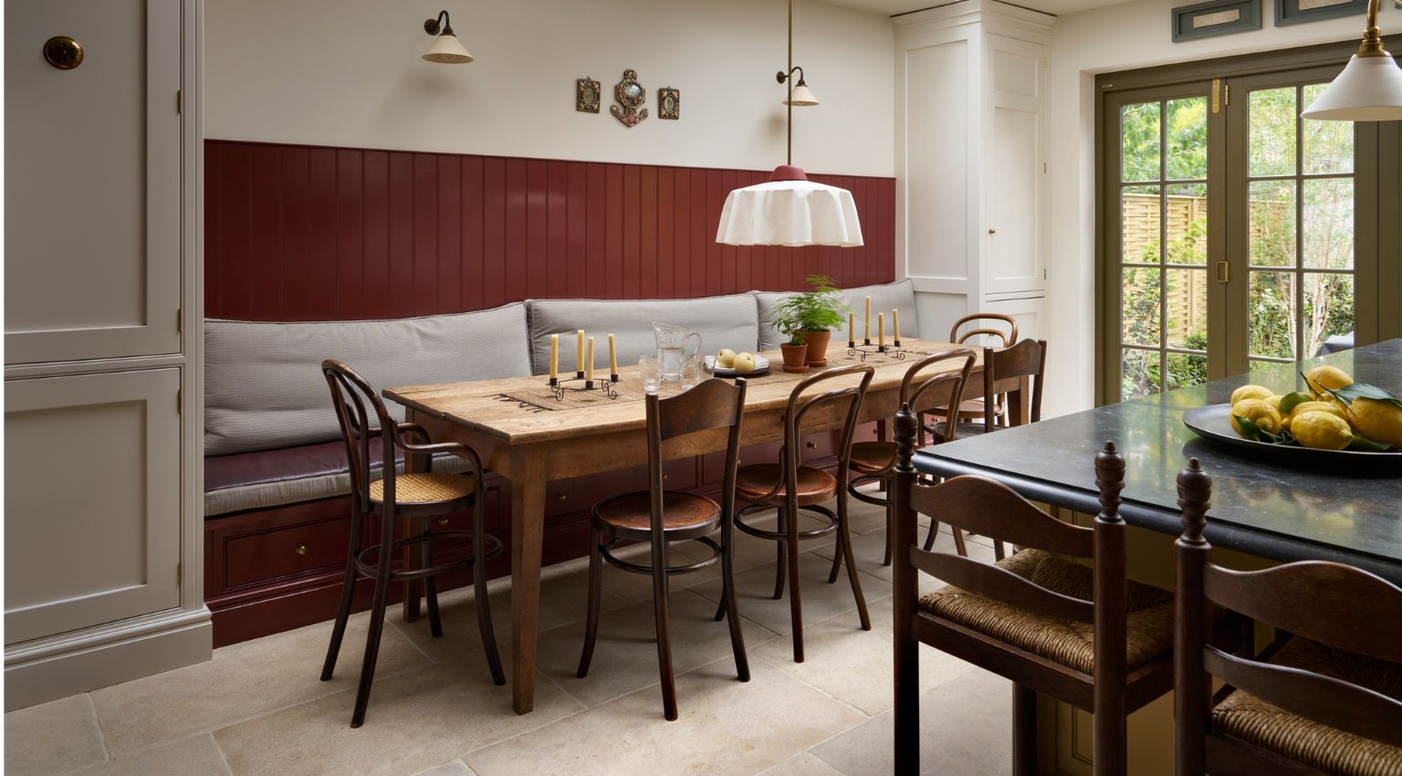 Timeless kitchen dining table with colourful wall panelling
