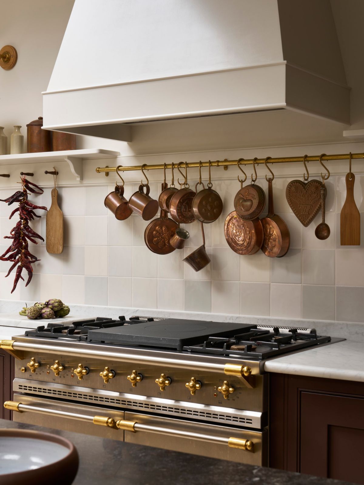 Kitchen range with pan rack behind