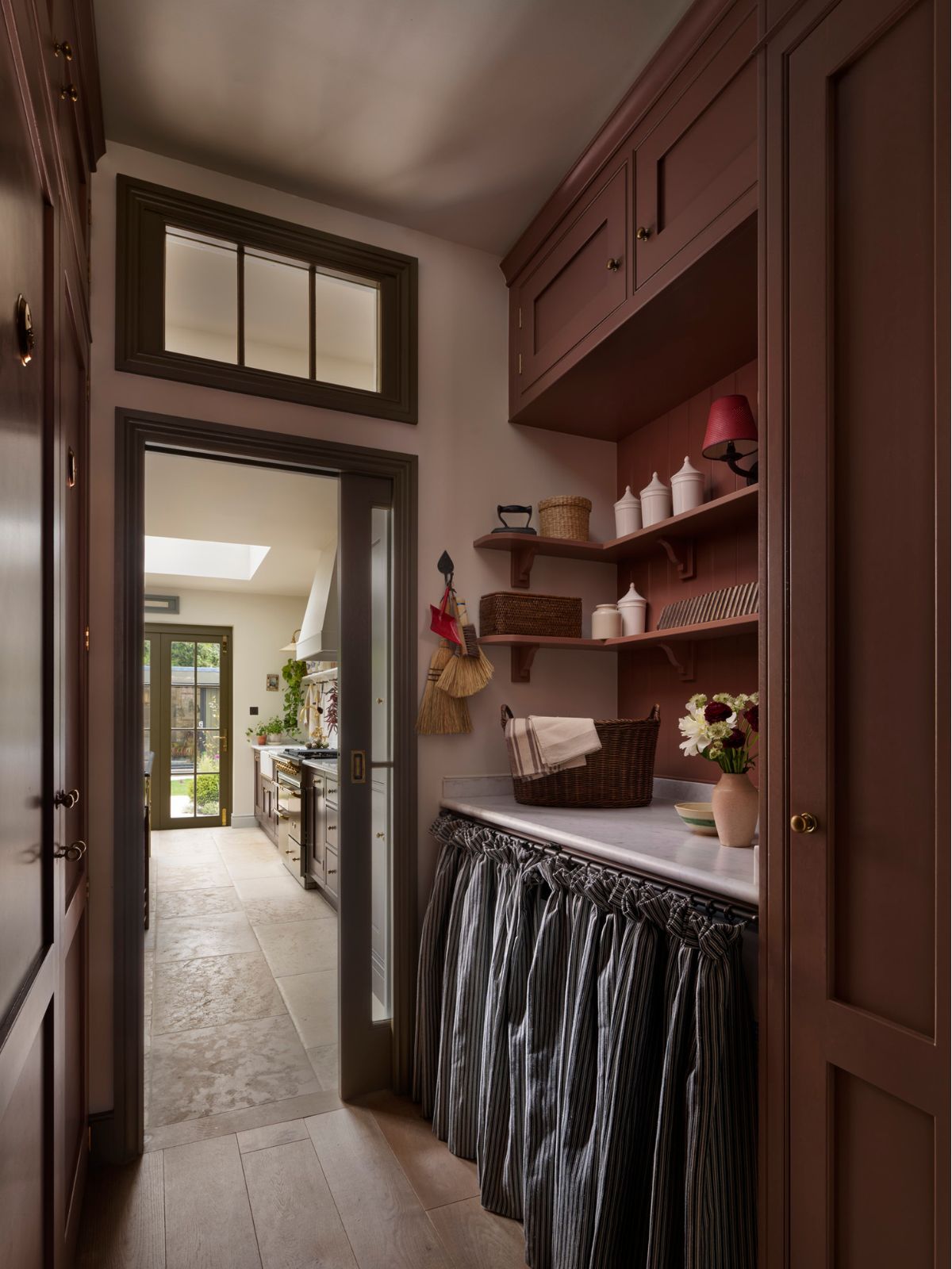 Bespoke utility space flowing into timeless kitchen