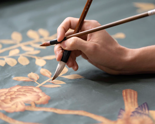 Artist creating bespoke Fromental Wallcovering